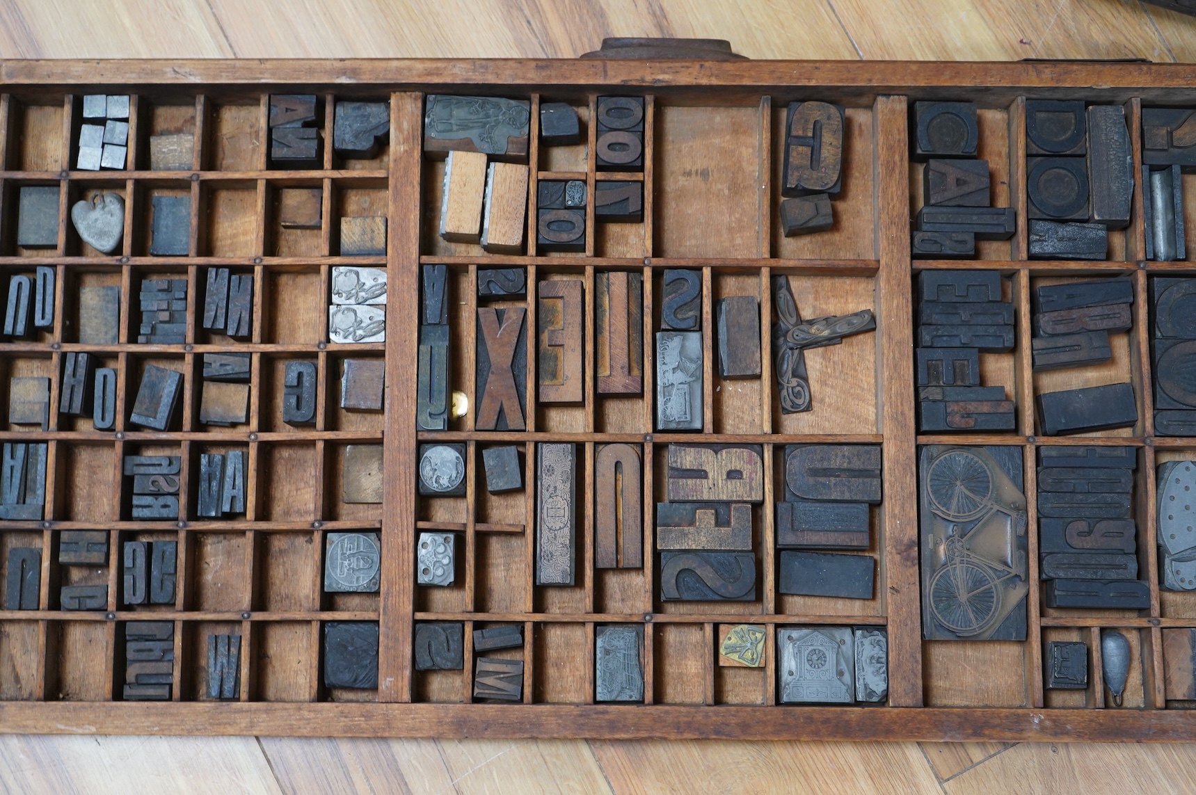 A printer's tray and various type-sets